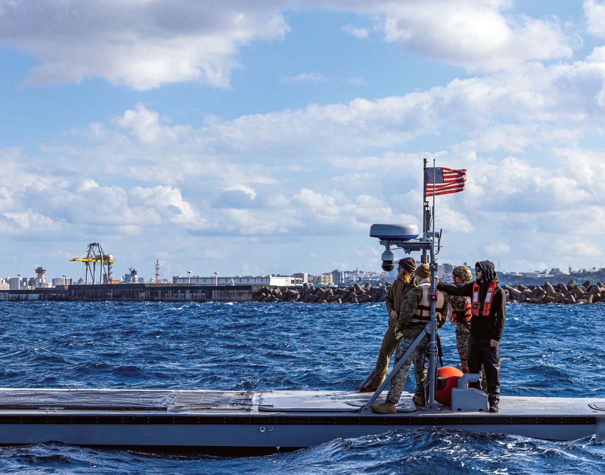 U.S. Marines operate an Autonomous Low-Profile Vessel at Naha Military Port, Okinawa, Japan, January 17, 2025. Marines with 12th Littoral Logistics Battalion executed the first ALPV rehearsals in Okinawa, increasing 12th LLB’s operational readiness and amphibious capabilities. The ALPV is a semi-submersible autonomous logistics delivery system that has the ability to deliver multiple variations of supplies and equipment through contested maritime terrain. The Marines are with 12th LLB, 12th Marine Littoral Regiment, 3d Marine Division. (U.S. Marine Corps photo by Lance Cpl. Rodney Frye) (Details on the vessel have been blurred for security reasons)
